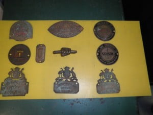 Historic emblems from second-hand safes restored by Clark Locksmiths
