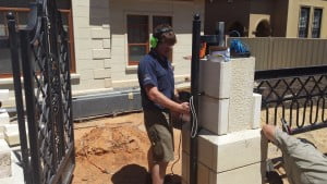 Installing a lock in a front gate pillar in Adelaide