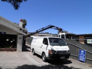 Transporting safes using cranes is a regular occurrence for Clarke Locksmiths all around metropolitan Adelaide and country South Australia